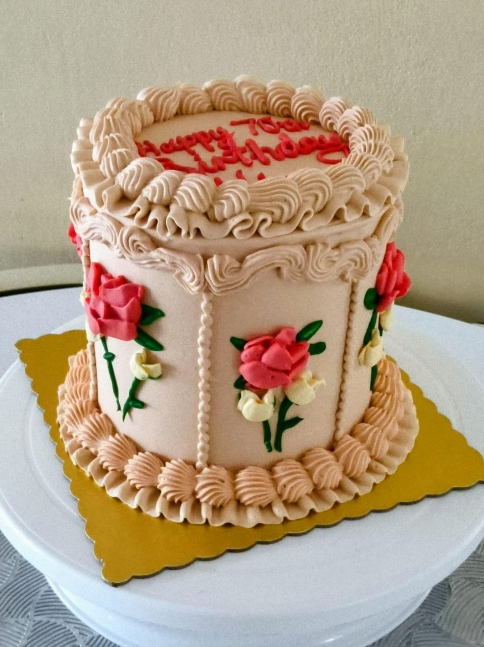 Elegant cream cake with pink flowers